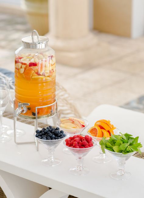 Lately I have been trying to make more creative cocktail stations for my parties so when I hosted a Mom’s Night Out at my house last week I created this sweet Sangria Bar with a yummy selection of toppings for everyone to garnish their drinks. Key elements to this display are a fun drink dispenser {I got this one at West Elm. It’s... Diy Sangria Bar, Diy Sangria, End Of Summer Party, Sangria Drink, Sangria Bar, Food Display Table, Cocktail Station, Fashionable Hostess, Drink Display