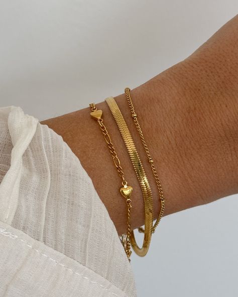 Gold Herringbone (Snake) Chain Bracelet Length of Bracelet: approx. 6 - 8 inches (adjustable) 18K Gold Plated Stainless Steel Chic Gold Bracelet, Bracelet Pictures Ideas, Gold Chain Bracelet Women, Bracelet Ideas Gold, Gold Bracelet Stack, Goals 2024, Gold Figaro Chain, Wrist Stack, Gold Bracelets Stacked