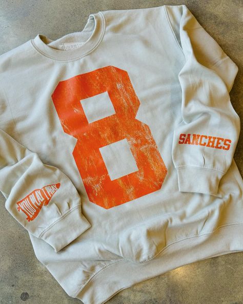 SNEAK PEEK!! 😍 We are launching some new fun designs for fall this Friday 🥳 and we could use your help getting the word out! As a BIG thank you we want to gift TWO of you one of our NEW CUSTOM sweatshirts 👏🏻👏🏻 To help us is simple: ✔️Like this post ✔️Tag your sports mom friends ✔️Share in stories (if your page is private please let us know you shared 😉) Launch is live at 8am Friday morning! We will announce the 2 winners that morning here! We are so excited about these customs tops!... Games For Moms, Basketball Sweatshirts, Soccer Mom Shirt, Sports Sweatshirt, Mom Friends, Add Sleeves, Custom Top, Football Mom Shirts, Football Sweatshirt