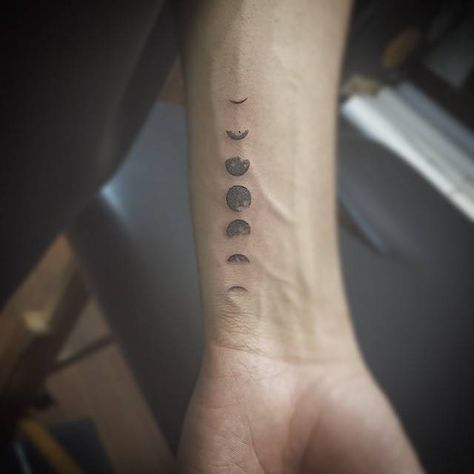 Small black-work style tattoo of moon phases inked on the inner side of the left wrist Astronomy Tattoo, Moon Phases Tattoo, Men's Small Tattoo, Wrist Tattoos For Guys, Phases Of The Moon, Small Tattoos For Guys, Small Tattoo Designs, Little Tattoos, Trendy Tattoos