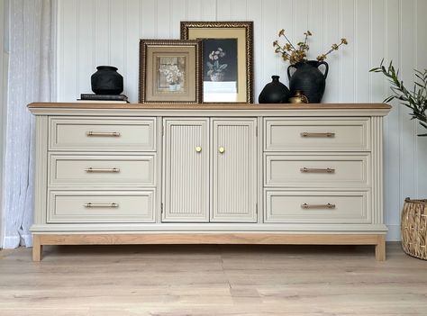 || AVAILABLE || Vintage solid Oak triple dresser in a beautiful mushroom taupe and light oak accents! Champagne bronze modern hardware to complement the beautiful moldings, which completes the look! This is a huge dresser measuring about 77” in length! Plenty of space with nine, dovetailed drawers! Would definitely add a neutral, light and airy accent piece to any space! Scroll to see a “before” picture as well! If you’re interested in purchasing this, please send a message! Locatio... Trending Home Decor For 2024, Taupe Dresser, Dresser And Tv, Living Room Dresser, Dining Room Dresser, Dresser In Living Room, Furniture Makeover Inspiration, Triple Dresser, Neutral Furniture