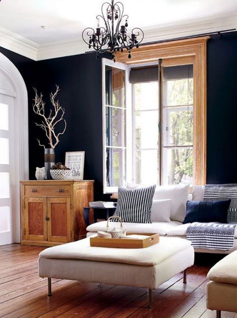 Wooden window frames and furniture add a rustic touch to this room. Black Painted Walls, Dark Walls, Design Del Prodotto, A Living Room, Black Walls, Living Room Inspiration, Home Fashion, 인테리어 디자인, Ideal Home