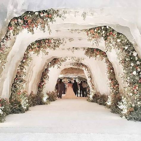 For the love of flower, here we bring you a floral tunnel inspiration for your indoor wedding celebration! Perfectly constructed by @rainforestthewedding, we are swooning over the play of blooms that create a dreamy and enchanting entrance. On top of that, the drapery arrangement resulted into an intimate end note. Who dreams of walking down this tunnel on their big day? Double tap and share this inspiration!  Photography @first_sanguans | Decoration @rainforestthewedding Wedding Tunnels, Wedding Reception Entrance, Fairytale Decor, Reception Entrance, Flower Backdrop Wedding, Reception Backdrop, Aisle Runners, Wedding Reception Backdrop, Wedding Venues Indoor