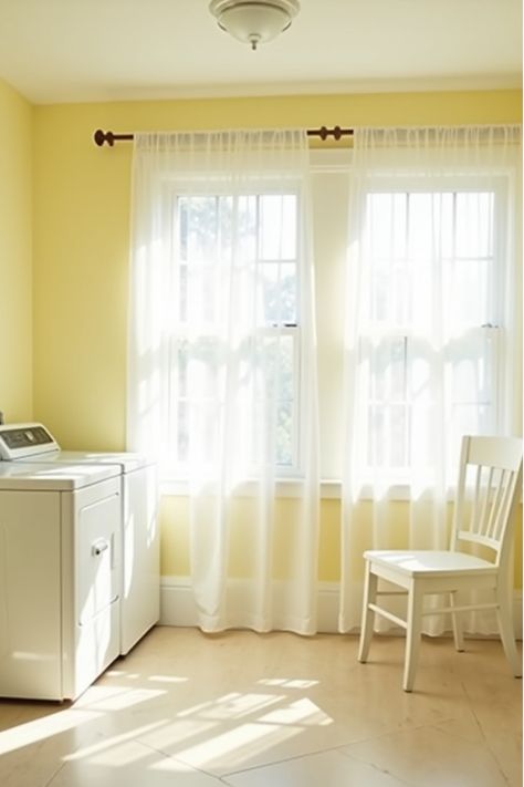 Bright laundry room with pale yellow walls and white curtains Laundry Room Yellow Walls, Laundry Room Yellow, Yellow Watercolor Wallpaper Laundry Room, Yellow Laundry Rooms, Pale Yellow Walls, Pale Yellow Shower Curtain, Laundry Room Colors, White Appliances, Doing Laundry