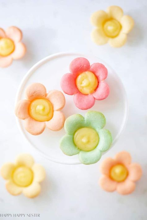 You've probably seen these Mini Lemon Flower Tarts all over social media. I jazz them up by adding colorful twists to my homemade cookie dough. Those springtime colors give these treats an extra pop! They're not just adorable—they're delicious, all thanks to that sweet, tangy lemon curd filling paired with the sugar cookie. Plus, they're super easy to make! Flower Lemon Tarts, Flower Tartlets, Flower Tarts, Colorful Twists, Easy Spring Desserts, Nutcracker Tea Party, Mini Lemon Tarts, Lemon Tartlets, Berry Cobbler Recipes