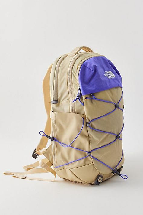 The North Face Borealis backpack is fitted with a FlexVent suspension system with a flexible yoke built from custom injection-molded shoulder straps, a padded mesh back panel and a breathable lumbar panel for an ultra-comfy feel at school, work or travel. Features The North Face Borealis backpack Lightweight backpack design Stand-up style 15" laptop sleeve Tons of flexible padding for comfort Padded mesh back panel Water bottle pocket Content + Care Recycled nylon ripstop with DWR finish Spot clean Imported Size 28L Dimensions: 13.25" l 9.75" w x 19.75" h | The North Face Borealis Backpack in Neutral, Women's at Urban Outfitters Backpacks For Back To School, Granola Backpack, Backpack Inspo School, Northface Backpacks, Backpack Must Haves, High School Backpacks, Backpacks Aesthetic, Backpacks For High School, Urban Outfitters Backpack