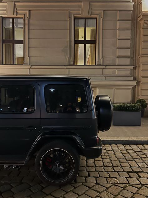 A black mercedes g wagon in front of the Ritz-Carlton in Vienna Austria G Wagon Interior Aesthetic, Black G Wagon Aesthetic, Mercedes G Wagon Black, Mercedes G Wagon Aesthetic, Limousine Aesthetic, G Wagon Black, G Wagon Aesthetic, Wien Aesthetic, World Expensive Car