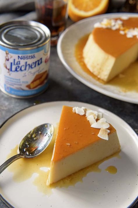 You don't have to be on a tropical vacation to enjoy a slice of this silky-smooth Orange Coconut Flan - it's just as easy to make at home! A tasty variation on the classic, this flan de coco combines a creamy coconut custard with an orange-rum caramel crown. #crumbykitchen #flan #flandecoco #coconutflan #hispanic #dessertrecipes Coconut Pastries, Coco Flan, Coconut Flan Recipe, Cuban Flan Recipe, Flan Recipes, Fruit Flan, Rum Caramel, Pumpkin Flan, Coconut Flan