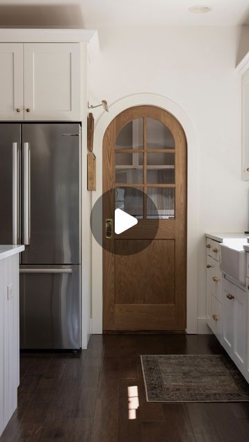 Erin Gerlach | Hamilton Park Home on Instagram: "Arched pocket door reveal ✨ Get the arched pocket door look with a regular square door (and at a fraction of the cost)! I replaced our existing pocket door with this beautiful wooden door from @simpsondoorco. And once it’s placed in an arched opening, bam… arched door look achieved!!!" Rustic Pocket Doors Ideas, Round Pocket Door, Kitchen With Pocket Doors, Pocket Door To Pantry, Dutch Pocket Door, Wooden Pocket Doors, Diy Arched Door, Arch Pantry Door, Arch Pocket Door