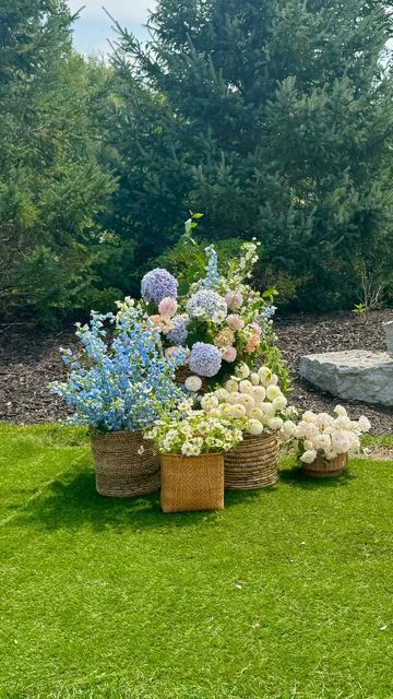 Michigan Wedding Florist || Alicia Gonzalez Winn on Instagram: "Don’t let anyone tell you that you need an arch or arbor for your wedding ceremony! The possibilities for ceremony backdrops are endless! We love when we are able to think outside the box with clients like this cute wicker basket installation for Makayla and Erik! 🤍

#weddingflorist #weddingceremony #wedding #michiganflorist #michiganwedding" Non Floral Wedding Arch, The Baumberhof, Meadow Wedding Ceremony, Outdoor Ceremony Flowers, Wildflower Wedding Ceremony, Michigan Wildflowers, Hydrangea Garland, Never Getting Married, Holy Matrimony