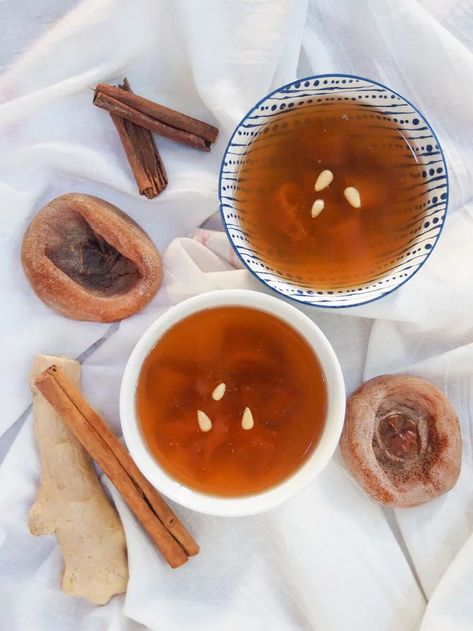 Sujeonggwa is a Korean cinnamon tea served cold, but with plenty of gently sweet warming spice flavor Ginger Cinnamon Tea, Cinnamon Tea Benefits, Korean Sweets, Korean Tea, Dream Cafe, Asian Dessert, Tea Drink Recipes, Cinnamon Benefits, Spiced Drinks