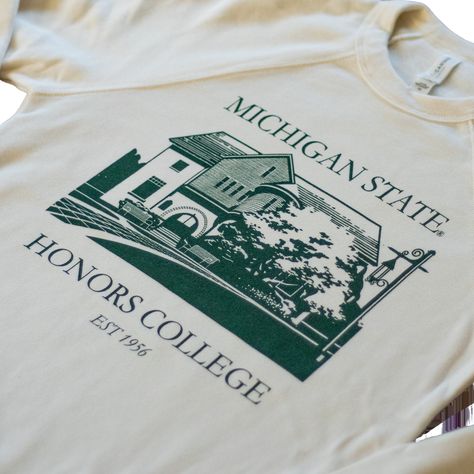 This sweatshirt has a vintage look and fleecy feel. Available in the color natural, it has a dark green imprint of historic Eustace-Cole Hall and features the text “Michigan State University”, “Honors College”, and “Est 1956”. 52% cotton/48% polyester Machine wash cold gentle Available in natural Unisex sizing Made in USA College Club Merch Ideas, College Merch Aesthetic, College Merch Ideas, School Sweatshirts Designs, College Spirit Wear, Honors College, Dark Green Crewneck, School Merch, University Merch