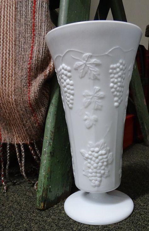 "These are a pair (Sold Separately) of beautiful Mid-century White Milk Glass with a repeating Harvest Pattern of raised grapes, vines, and leaves that I was lucky enough to find at an estate sale. I believe these are from the 1950s. There are no manufacturer marks on any part of either piece. 1 . The first piece is a Mid-century White Milk Glass Trumpet Vase, and has a short pedestal base and is a pure creamy white color. It is in excellent condition, but there is some slight roughness along th Glass Trumpet Vase, Milk Glass Decor, Antique Appraisal, Milk Glass Collection, Pretty Dishes, Vine Pattern, Milk Glass Vase, Daniel Fast, Antique Glassware