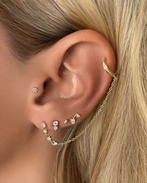 NEW ARRIVAL ALERT ✨ Meet our latest versatile earring: This Multi Way Wear Dangle Chain Stud Earring with Reversible Cuff requires only one piercing. The cuff suspends on a chain that you can place throughout your cartilage depending on your styling desire. The cuff has a polished gold back and CZ diamond front, allowing you to wear this two different ways. Cz Diamond, Stud Earring, New Arrival, Piercings, Stud Earrings, Cuff, Chain, Gold, How To Wear