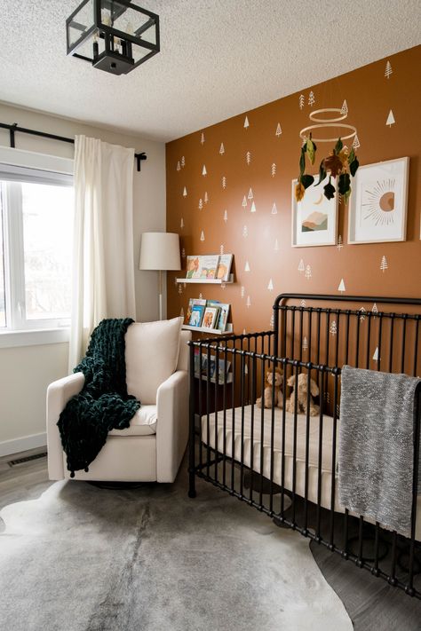 Find out all about this nursery design on our new blog post!  Design by Kierstin Smyth Design.  #edmontoninteriordesign #nurserydesign #naturedesign #kierstinsmythdesign Burnt Orange Nursery Ideas, Moody Nursery Ideas, Orange Nursery, Eclectic Nursery, Nature Nursery, Blog Post Design, Small Guest Room, Nursery Accent Wall, Black Nursery