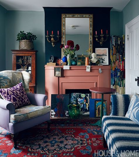 Inspired by eclectic British decor, this living room keeps things light with an array of bohemian textiles and patterns and an artfully cluttered mantel featuring art and knickknacks in unexpected places. | Photographer:  Michael Graydon Bumblebee House, Lounge Colours, Colourful Rooms, Fireplace Styling, Chimney Decor, Maximalist Living Room, Family Friendly Living Room, Persian Decor, Inspiration Deco