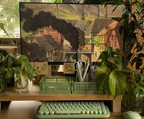 Green Studio Aesthetic, Ghibli Office Aesthetic, Aesthetic Desk Setup Green, Green Desk Aesthetic Office, Green And Brown Desk Setup, Studio Ghibli Office Decor, Brown Gaming Aesthetic, Studio Ghibli Desk Aesthetic, Green And Brown Gaming Setup