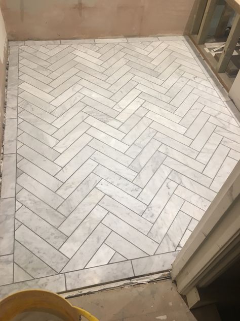 Carrera marble herringbone with manhattan grey grout #kerryvilla #tottenham #renovation Herringbone Floor Bathroom, Herringbone Tile Bathroom Floor, Herringbone Bathroom Floor, Marble Herringbone Floor, Herringbone Tile Bathroom, Herringbone Tile Floors, Marble Bathroom Floor, Marble Herringbone, Grey Grout