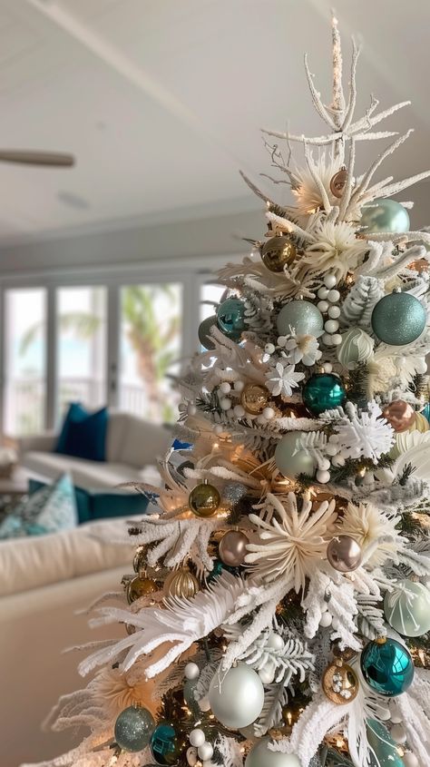 12 Stunning Christmas tree Themes {2024} - House On Austin Aqua Blue Christmas Tree, Aqua Christmas Tree Decor, Teal And Champagne Christmas Tree, Tropical Christmas Tree Ideas, Beachy Christmas Tree Ideas, Turquoise Christmas Tree Ideas, Teal Christmas Tree Ideas, Teal And Red Christmas Decor, Beach Theme Christmas Tree Ideas