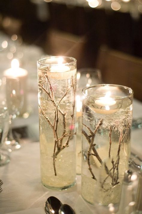 I designed my winter wedding around the idea of snow filled forest, using natural pieces like twigs, bark, and fire to make it warm and cozy. The guests all commented on the warm and classic feel and the not-overly-obvious theme. My colours were champagne, navy and ivory. I am selling the majority of my decor; please see a list below:  Extra Large Vases (shown with flowers), including "ice rock" and twigs, tulle optional: x8 [Diameter 6 ¼ ", Height: 26 ¾ "]  $30.00 each or $225 for 8 // ... Fire And Ice Wedding, Ice Wedding, Ice Party, Wedding Forest, Snow Wedding, Gel Candles, Prom Theme, Winter Wonderland Wedding, Forest Wedding