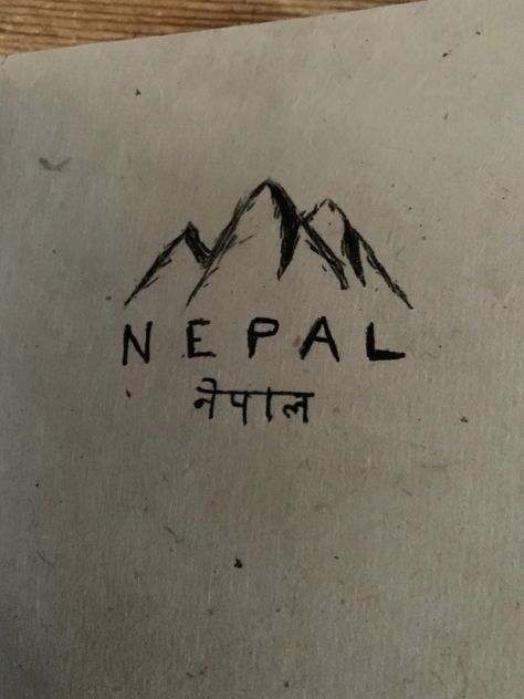 Three mountain peaks designed after the Himalayas. Underneath is text in both English and Nepalese reading “Nepal” Nepali Tattoo Design, Nepal Tattoo Ideas, Nepalese Tattoo, Nepali Writing, Nepal Drawing, Nepal Illustration, Nepali Tattoo, Nepal Tattoo, Drawn Mountains