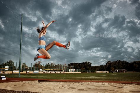 Female athlete performing a long jump during a competition by master1305. Female athlete performing a long jump during a competition at stadium. The jump, athlete, action, motion, sport, succ...#long, #jump, #competition, #Female Long Jump Aesthetic, Jump Aesthetic, Female Athlete, Triple Jump, Sport Portraits, Run Runner, Sports Aesthetic, Long Jump, High Jump