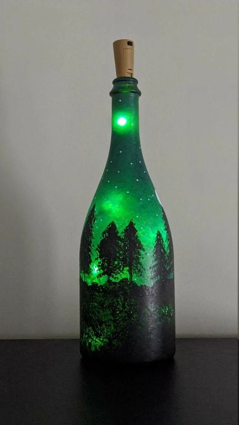 Champagne Bottle Art, Wine Bottles In The Garden, Wine Bottle Painting Ideas, Wine Bottle Crafts With Lights, Bottles In The Garden, Crafts With Lights, Painted Glass Bottles, Hand Painted Wine Bottles, Hand Painted Bottles