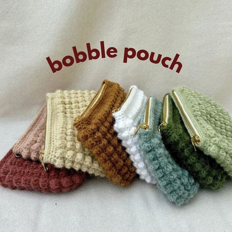 introducing the bobble pouch✨ these are perfect makeup bags or pencil pouches! They are going to be available on my etsy store in 8 different colors and lined with floral fabrics. Check them out in just 3 days!!! . . . #bobble #bobblestitch #smallbusiness #smallbusinessowner #bobblepouch #makeupbag #makeupbags #pencilpouch #pencilpouches #crochet #crochetlove #crochetaddict #etsy #etsyshop #etsyseller Crochet Pouch With Zipper, How To Crochet A Pouch, Crochet Makeup Pouch, Makeup Bag Crochet, Crochet Pencil Pouch, Granny Square Pouch, Crochet Zipper Pouch, Crochet Makeup Bag, Crochet Pouches