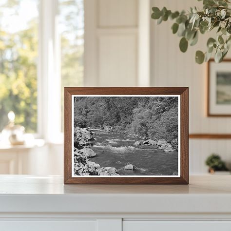 A mountain stream flows through Cache County, Utah. Captured in August 1940, this vintage image depicts the Logan River and its natural surroundings. The photo provides a glimpse into the mid-20th century landscape of Utahs waterways, reflecting the ecological features and serene beauty of the region during that era. A statement in any room, each reproduction is printed on museum-quality archival paper using a restored version of the original. Click "Add to Cart" to proceed to safe and secure checkout via PayPal, Visa, MasterCard, Discover, American Express, Amazon, Google, or Apple Pay.