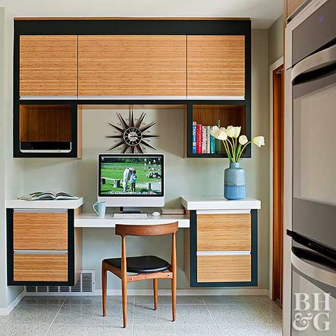 In this kitchen, a tiny nook contains a charming message center with ample vertical storage space. The desk area is just large enough to hold a tablet, cookbook, and other necessary tools. White built-ins with nickel bin pulls and a collection of mason jars reinforce the kitchen's vintage style. Farmhouse Kitchen Cabinet Decor, Kitchen Workstation, Workstation Ideas, White Built Ins, Starburst Clock, Kitchen Work Station, Bamboo Cabinets, Semi Custom Cabinets, Used Cabinets