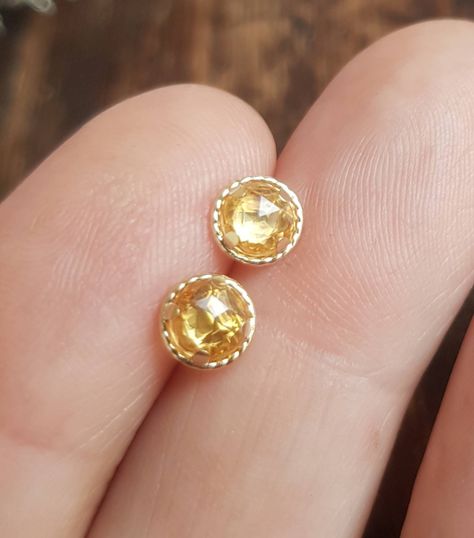 yellow sapphire gold earrings. Rose cut sapphire earrings. Yellow sapphire and gold halo stud earrings. September birthstone earrings. https://etsy.me/3rIja0y Classic Formal Yellow Sapphire Jewelry, Classic Round Cut Yellow Sapphire Jewelry, Golden Sapphire Earrings, Round Yellow Sapphire Gemstone Jewelry, Yellow Sapphire Earrings Studs, Blue Sapphire Studs, Citrine Earrings Studs, Red Sapphire, Sapphire Studs