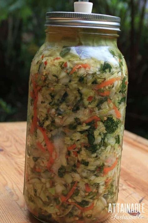 This easy kimchi recipe is spicy and crunchy and salty - it's a great side dish to go with meat and fish when you don't have time to make a salad. Making kimchi is easy. This (vegan) kimchi recipe calls for lots of slicing and dicing, but that's really all it entails. Once chopped, it's just a matter of fermenting the vegetables. #fermenting #preservation #recipe White Kimchi Recipe, Easy Kimchi Recipe, Kimchee Recipe, Vegan Kimchi Recipe, Kimchi Recipes, Making Kimchi, Fermented Vegetables Recipes, Easy Kimchi, Pickled Foods