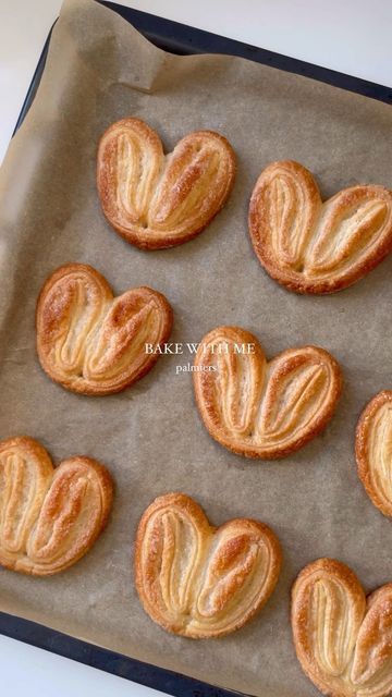 Damla Gundogan on Instagram: "Palmiers 🫶 Recipe… Preheat oven to 200C - Roll ready puff pastry into a rectangle and add plenty of sugar - keep folding dough - place in the freezer for 15 minutes - take out and cut into equal pieces - bake for 15 minutes, making sure both sides are golden. Enjoy ❤️ #valentinesday #valentines #galentines #valentinesbaking #baking #recipe #pastry #bakingrecipes" Shoe Pastry How To Make, Puff Pastry Folds, Pastry Folding, Puff Pastry Hearts, Palmiers Recipe, Heart Biscuits, Valentines Galentines, Valentines Baking, Heart Cookie