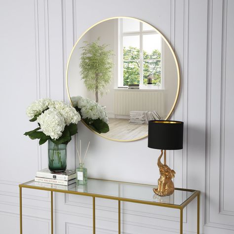 Reflect your interior style with this round mirror. With a simple curved design contrasted with the frame, this small mirror will stand out and make a statement on any wall in your home. Combining light and dark materials, the round wall mirror will add a touch of industrial style to your décor whether it is placed in the hallway, living room or bathroom. Round mirrors are perfect for giving a room a soft touch as well as reflecting light to make the space look bigger and brighter. Completed wit Spiegel Gold, Small Round Mirrors, Round Gold Mirror, Laura James, Large Round Mirror, Elegant Vanity, Trifold Mirror, Mirror Wall Bedroom, Gold Mirror Wall