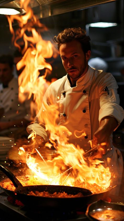 Download 'Flaming Culinary Performance' - A skilled chef masterfully controls a dramatic burst of flames while preparing a dish in the kitchen. - Get this free stock photo and more high-quality images on StockCake. No attribution required. Chef Cooking Photography Kitchens, Chef Cooking Photography, Chef Wallpaper, Chef Photo, Culinary Photography, Chef Photography, Cooking With Fire, Chef Images, Chef Pictures