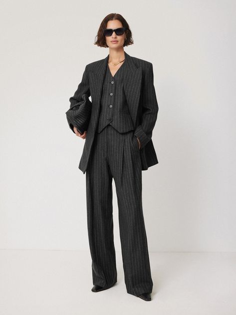 Introducing the Tatton, our new season tailoring shape. Patterned in-house for the perfect fit, this double-breasted blazer has a directional silhouette and structure through the shoulder. Crafted in a charcoal pinstripe wool-blend fabric from Italian heritage mill, Mantecco. Fully lined, featuring a melton undercollar, internal piping, front flap pockets and a single back vent. Arrives oversized so size down for a more fitted silhouette. Matching trousers and waistcoat complete this three-piece powerhouse suit or pare it back over jeans and a cotton shirt. Pinstripe Blazer, London Shopping, Italian Heritage, Pinstripe Suit, Jean Belts, Three Piece Suit, Breasted Blazer, Knitted Gloves, Double Breasted Blazer