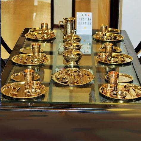 Buy a traditional Brass royal dinner set from Indian Bartan. The 6 Person Royal Brass Dinner Set is made in India with brass. It includes 6 Full Plates,6 Half Plates,6 Glasses,6 Bowls,6 Dish Plates,3 Serving Bowls with lid,1 Rice Plate,1 Jug,12 Spoons,3 Serving Spoons. Indian Kitchen Utensils, Royal Dinner, Vintage Kitchen Gadgets, Dinnerware Set Modern, Serving Bowls With Lids, Crockery Design, Formal Table Setting, Modern Kitchen Storage, Indian Dinner