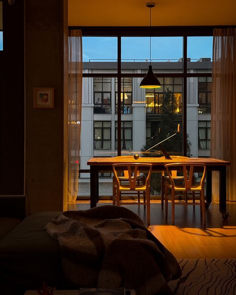 The soft lighting and minimal setup give it a peaceful vibe, perfect for a quiet evening indoors. Minimal Setup, Quiet Evening, Cozy Evening, City Views, Apartment Inspiration, Desk Setup, Apartment Interior, Living Room Lighting, City View