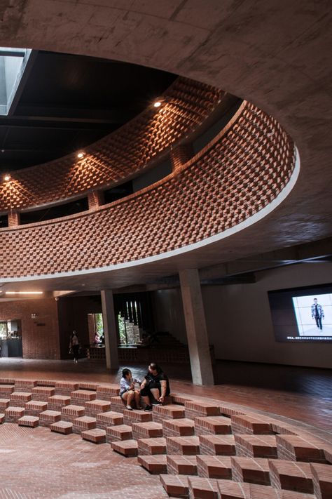 The Red Brick Art Museum in Bejing, China, designed by architect Dong Yugan, uses brick for interior and exterior cladding incorporating sculptural surfaces and structures. Brick Construction Architecture, Museum Facade Design, Cheap Architecture, Car Design Ideas, Brick Interior Design, Brick Sculpture, Structuralism, Architectural Finishes, Circular Buildings