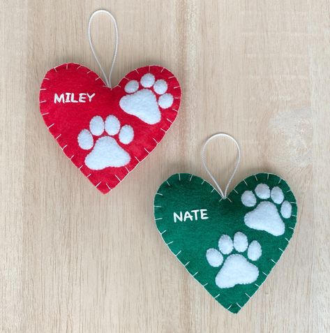 Add a touch of handmade to your holiday decor! This felt pattern is a fantastic gift for all pet lovers! Commemorate pets by making these ornaments for your family and friends!  **THIS IS A PDF PATTERN DOWNLOAD. ** No finished product will be shipped.  You will receive the PDF pattern for the felt paw print ornament, so that you will be able to hand sew and create your very own felt ornament.  This ornament measures roughly 4.5" wide. This pattern includes a list of all supplies needed and step- Felt Dog Pattern, Diy Dog Ornaments, Felt Ornaments Patterns Free, Easy Felt Christmas Ornaments, Pet Ornaments Diy, Dog Ornaments Diy, Christmas Pet Ornaments, Cat Paw Print Ornament Diy, Felt Cat Ornament Christmas