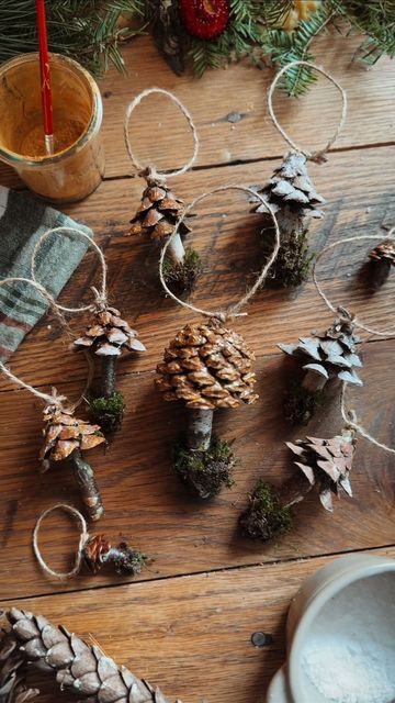 Cassandra Evans (Sunny) // Folk Living on Instagram: "Totally making little trees with this method, too! 🌲  I used hot glue to affix the stick to the pinecone, but I also tried melted beeswax and that worked well! Paired with this compostable glue would keep them 100% biodegradable and able to be returned to nature!   Here’s what you’ll need to make one cup of glue:  1 1⁄2 cups (350 ml) water 2 tablespoons of corn syrup or honey 1 teaspoon (4.9 ml) of vinegar 2 tablespoons (15 g) of cornstarch  1. In a saucepan, stir together 3/4 C (180ml) water, syrup, and vinegar and bring to a boil.  2. Combine the cornstarch and remaining 3/4 C of water and then whisk into mixture. Return to a boil and continue cooking for 1 minute.  3. Remove from heat and allow to cool. Store in airtight container. Diy Foraged Christmas Decorations, Pinecone Mushroom, Winter Nature Crafts, Pine Cone Ornament, Yule Crafts, Cooking For 1, Mushroom Crafts, Acorn Crafts, Natural Christmas Decor