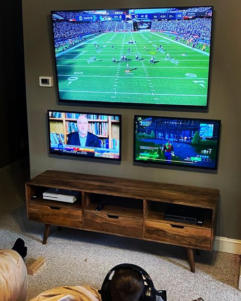 TV wall, Xbox, PlayStation, game room ideas, big Joe bean bags Video Game Area In Basement, Multi Tv Game Room, Man Cave Multiple Tv Set Up, Xbox Tv Setup, Family Video Game Room, Man Cave Multiple Tvs, 2 Tvs In Game Room, Sports Game Room Ideas, Two Tv Game Room