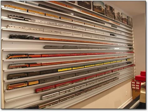 Love this wall mounted display method for a miniature train collection. Shelves For Collectibles, Wall Mounted Display Case, Model Train Display, Train Display, Miniature Train, Train Collection, Ho Train Layouts, Model Train Table, Model Train Accessories