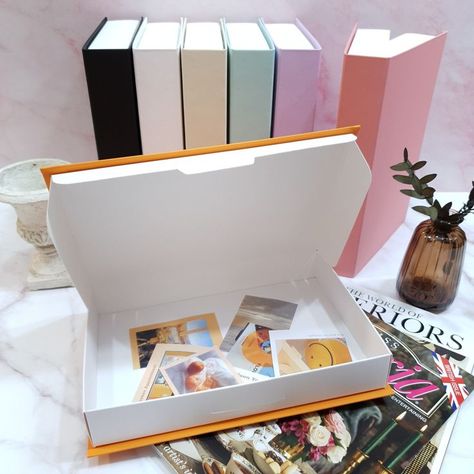 Elevate your bookshelf aesthetics with our stylish book-shaped boxes designed for organized readers. These functional and decorative boxes seamlessly blend into your book collection, providing discreet storage for small items or keepsakes. Transform your bookshelf into a display of literary elegance with our collection of book-shaped boxes. #BookshelfEnvy #OrganizedReaders #LiteraryElegance #bookboxes #bookbox #bookstagram #kitapkutusu #saint #booklover #bookish #books Box Coffee Table, Flat Lay Props, Home Decor Photography, Secret Box, Decor Photography, Stash Box, Lilac Pink, Secret Compartment, Stationery Storage