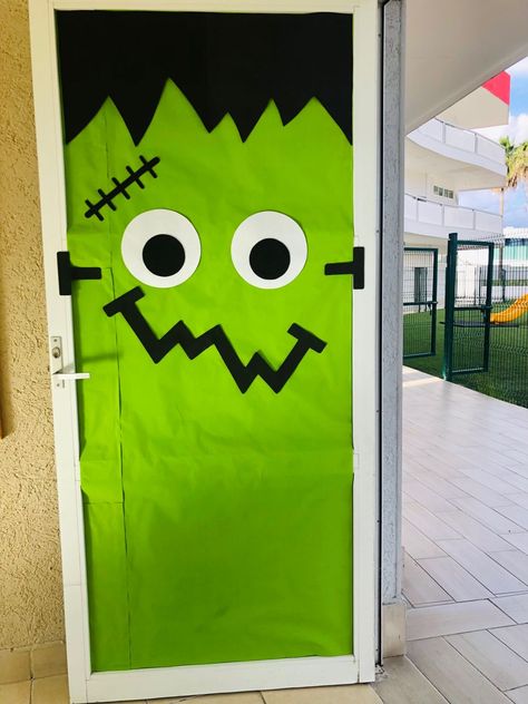 Haloween Door Frankenstein Frankenstein Window Art, Frankenstein Door Decorations For School, Frankenstein Diy Decor, Frankenstein Classroom Door, Easy Halloween Classroom Door Ideas, Frankenstein Bulletin Board, Halloween Classroom Door Decorations Ideas, Halloween Office Door Ideas, Easy Halloween Door Ideas