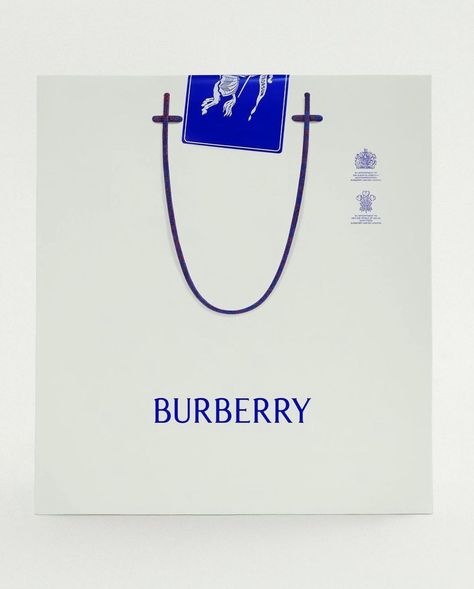 Why Burberry’s Detailed Campaign Imagery (under the helm of Daniel Lee) Is Top Tier Branding - Aside from hammering it into consumers… | Instagram Signature Style Clothing, Shopping Bag Design, Paper Bag Design, Clothing Packaging, Graphic Motif, Brand Icon, New Identity, Candle Packaging, Happy Design