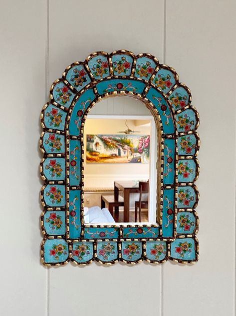 Frame is 16 inches high, 12 inches wide  Actual mirror is 10 x 6 Free shipping! Item will be packed securely for protection.  Handcrafted Peruvian painted glass arch mirror  made of mohena wood with gold leaf and antiquing glaze. Inspired by aqua mediterranean / Caribbean sea colors and landscapes. There is a hook on the back for hanging. Use alone or in a gallery. Other sizes available, please see other listings. Mirror In Hallway, Painting Mirror Frames, Mirror With Flowers, Bohemian Mirror, Marietta Georgia, French Mirror, Colorful Frames, Sea Colour, Arch Mirror