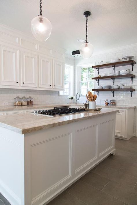 Amazing kitchen features white cabinets paired with Taj Mahal Quartzite countertops and a white subway tiled backsplash. Best Flooring For Kitchen, Flooring Designs, Kitchen Floor Tiles Ideas, Kitchen Top, Farmhouse Kitchen Remodel, Diy Kitchen Remodel, Unique Flooring, Classic Kitchen, Kitchen Floor Tile