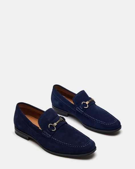 The GADDIS loafers are a structured dressy loafer complete with bit hardware across the top.  Bit loafer  Slip-on style  Horsebit hardware across top  Moc toe 1 inch heel height Suede upper material Textile and synthetic lining Rubber sole Imported Mens Dress Loafers, Blue Suede Loafers, Blue Loafers, Steve Madden Store, Bit Loafers, Dress Loafers, Apparel Merchandising, Men's Loafers, Wedding Suit