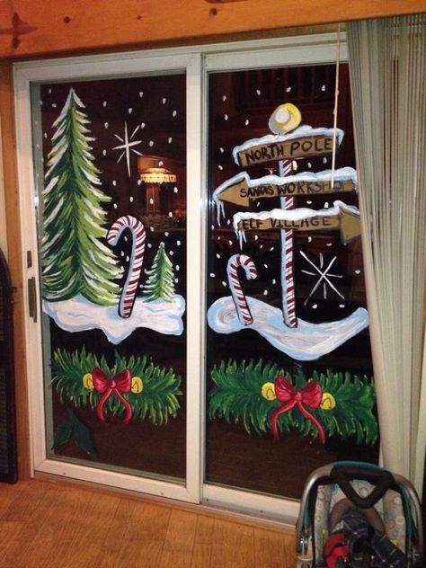 Cute Christmas Window Painting Ideas; Here are 20 easy Christmas window painting ideas to recreate on your windows this holiday season! Winter Tree Window Art, Christmas Window Classroom, Store Front Christmas Window Painting, Painted Window Christmas, Window Holiday Painting, Christmas Storefront Window Painting, Snowmen Window Painting, Winter Christmas Window Painting, Christmas Store Window Painting